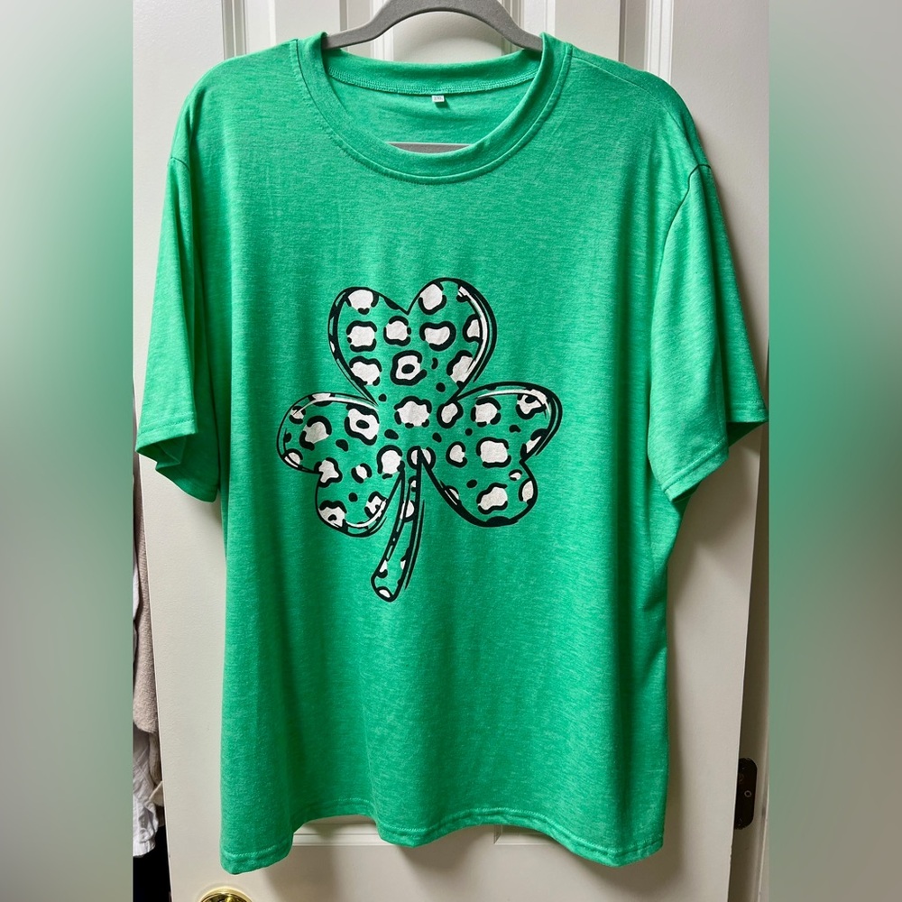 2X- green t-shirt with a black and white leopard-print shamrock graphic